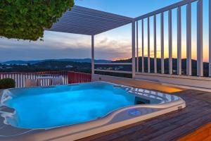 a swimming pool on the deck of a house at Skiathos Palace Hotel in Koukounaries