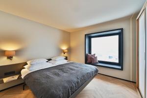 Postel nebo postele na pokoji v ubytování Warth52-W52 Apartments
