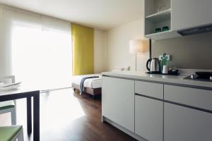 Nhà bếp/bếp nhỏ tại harry's home Linz-Urfahr hotel & apartments
