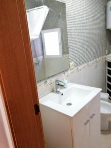 a bathroom with a sink and a mirror at CAMINO A MONASTERIO in Alhama de Aragón