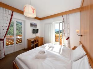 Ένα ή περισσότερα κρεβάτια σε δωμάτιο στο Al Piccolo Hotel