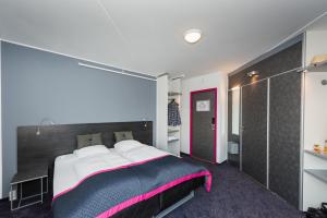 Cabinn Copenhagen客房内的一张或多张床位
