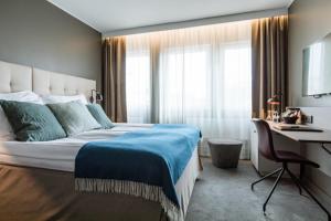 Postel nebo postele na pokoji v ubytování Clarion Hotel Gillet