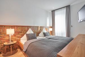 Postel nebo postele na pokoji v ubytování Hotel Goldener Engel