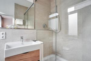 Koupelna v ubytování Hotel Goldener Engel + 30 fotografií