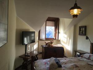 Posteľ alebo postele v izbe v ubytovaní Maison des Alpes mansarda