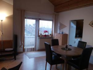 a kitchen and dining room with a table and chairs at Gaestehaus Kasper in Kenzingen