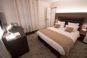 Katil atau katil-katil dalam bilik di Hôtel Bastide