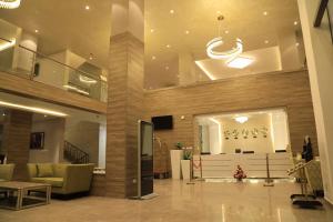 a lobby of a building with couches and a television at ELGEL Hotel and Spa in Nefas Silk