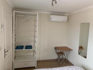 a bedroom with a bed and a desk and a closet at Apartment2 with terrace and a view near Amoreiras in Lisbon