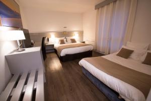 Katil atau katil-katil dalam bilik di Hôtel Bastide