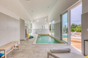 a swimming pool in the middle of a house at Villa Vela Muline - 8 plus 2 guests - heated pool in Ugljan