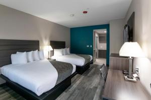 Postel nebo postele na pokoji v ubytování Express Inn