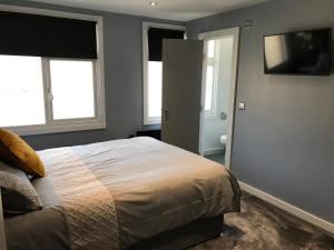 Postel nebo postele na pokoji v ubytování Cozy Rooms