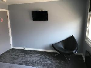 TV a/nebo společenská místnost v ubytování Cozy Rooms
