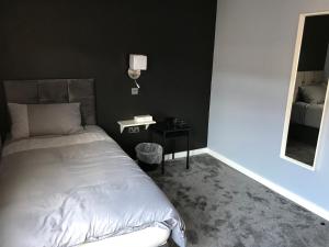 Postel nebo postele na pokoji v ubytování Cozy Rooms
