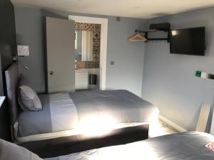 Postel nebo postele na pokoji v ubytování Cozy Rooms