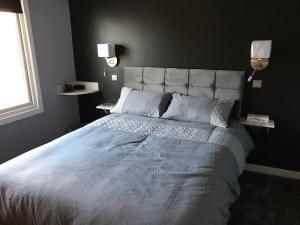 Katil atau katil-katil dalam bilik di Cozy Rooms