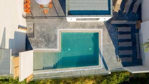 an overhead view of a swimming pool on a house at Hotel le Jardin d'Emile in Porticcio