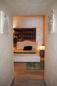 a bedroom with a large bed in the middle of a room at La Torre del Tempo in Turi