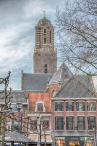 a church steeple with a clock tower at B&B In de Kromme Jak in Zwolle