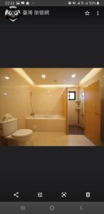 a bathroom with a toilet and a bath tub at Passion in Magong +35 photos