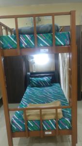 Postel nebo postele na pokoji v ubytování The Trekkers Hostel - Dehradun