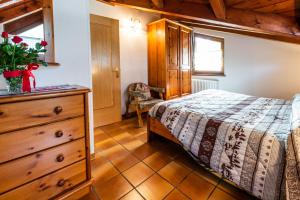 Postel nebo postele na pokoji v ubytování Casa dal Ri'