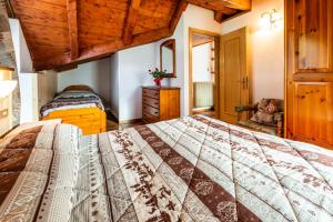Postel nebo postele na pokoji v ubytování Casa dal Ri'