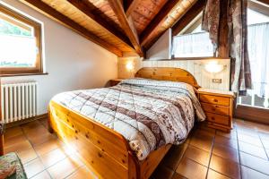 Postel nebo postele na pokoji v ubytování Casa dal Ri'