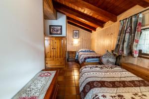 Postel nebo postele na pokoji v ubytování Casa dal Ri'