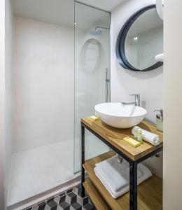 a bathroom with a sink and a shower at Mini loft 1 bedroom 2 steps from Av Louise in Brussels