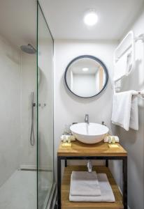 a bathroom with a sink and a mirror at Mini loft 1 bedroom 2 steps from Av Louise in Brussels