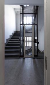 an open door of a building with a staircase at Tesla Design Apartments Zagreb in Zagreb