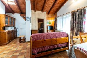 Postel nebo postele na pokoji v ubytování Casa dal Ri'