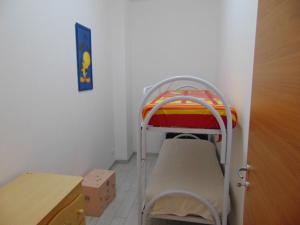 a small room with a bunk bed in a room at casa francesca in Castellammare del Golfo