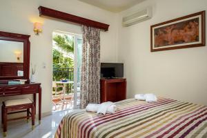 Postel nebo postele na pokoji v ubytování Lito Beach Hotel + 37 fotografií