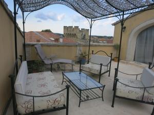 Un balcon sau o terasă la Entre vignes et dentelles