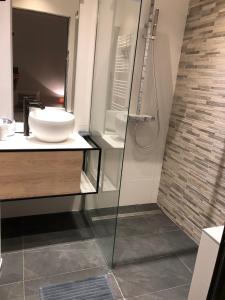 a bathroom with a sink and a glass shower at Chalet Le Triollet in Saint-Gervais-les-Bains +27 photos