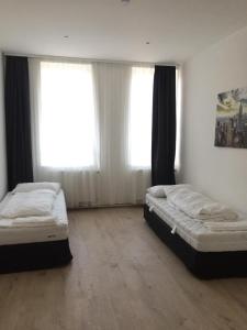 Cama ou camas em um quarto em Pension Dreilinden Hannover GmbH