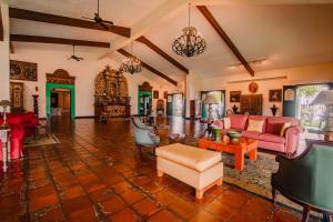 a living room filled with furniture and a fire place at Hotel El Convento Leon Nicaragua in León