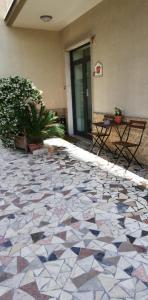 a lobby with a tiled floor in front of a building at B&B Dietro l'Angolo in Benevento