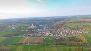 an aerial view of a town in a green field at Landgasthof Falken in Niederaltingen