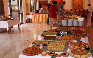 a buffet of food on tables in a room at Hotel Pirat in Kalkan