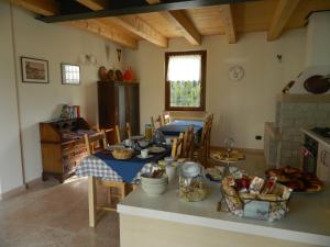 a kitchen with a table with food on it at B&B Corte Preare in Lavagno