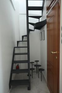 Leoforos 28is Oktovriou emeletes ágyai egy szobában