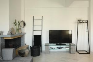 A television and/or entertainment centre at Leoforos 28is Oktovriou