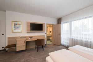TV a/nebo společenská místnost v ubytování Hotel SCHNEIDER
