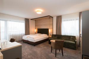 Postel nebo postele na pokoji v ubytování Hotel SCHNEIDER