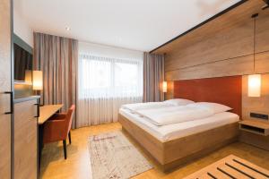 Postel nebo postele na pokoji v ubytování Hotel SCHNEIDER